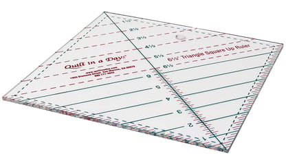 A clear, square Triangle Square Up Ruler 6-1/2in by Checker Distributor, featuring diagonal lines for cutting half-triangle squares and accurate measurements, shown on a white background.