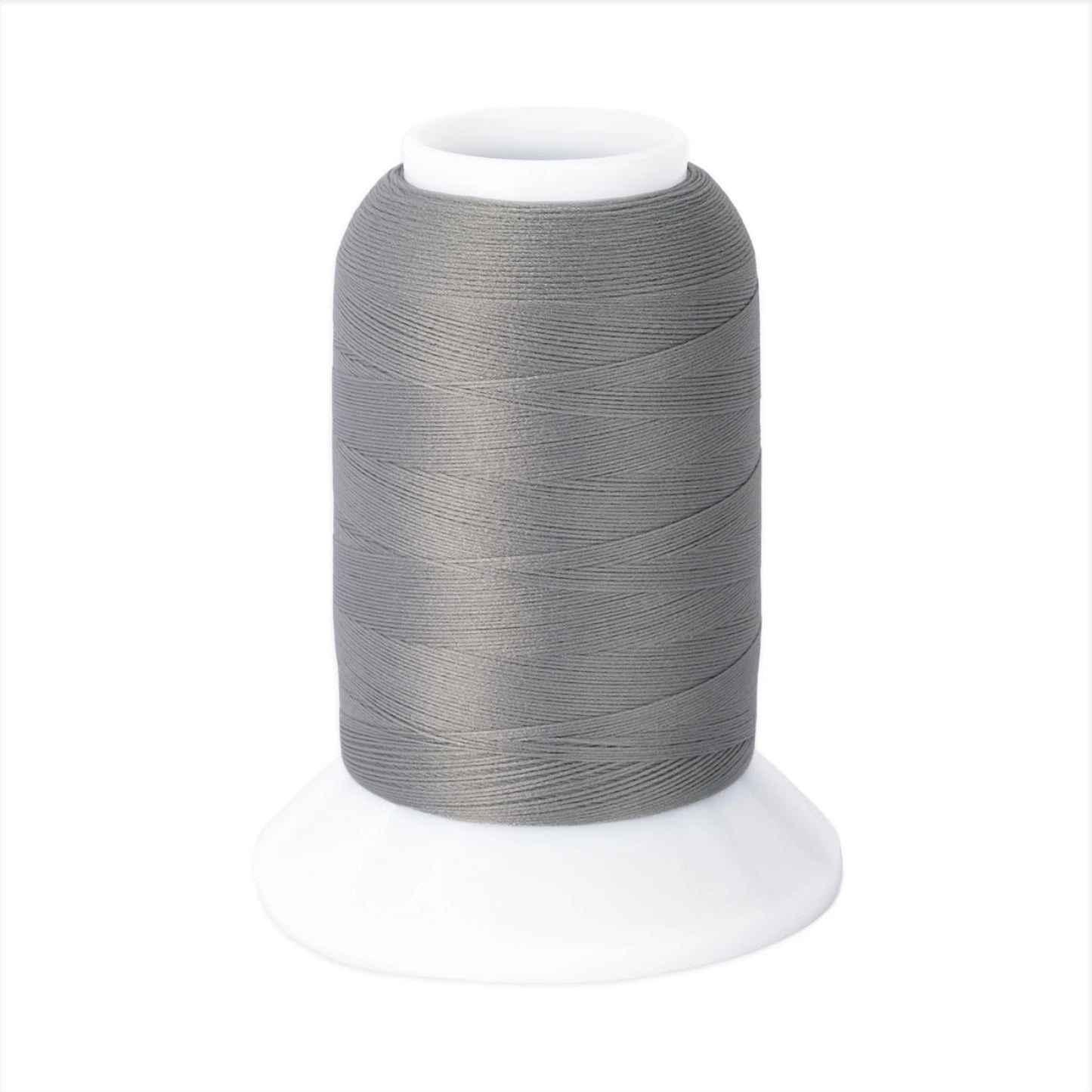 The Woolly Nylon #111 Grey 1000m thread by Checker Distributor sits on a white plastic base against a plain background, ideal for serging stretch knit fabrics.