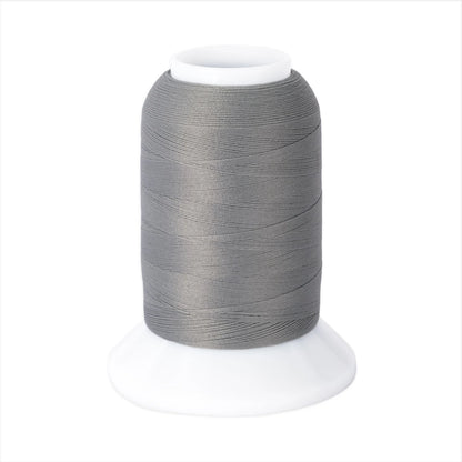The Woolly Nylon #111 Grey 1000m thread by Checker Distributor sits on a white plastic base against a plain background, ideal for serging stretch knit fabrics.