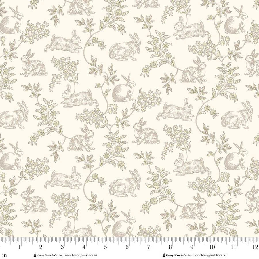 Candlelight & Romance Cream Toile 118" Wide Quilt Backing Fabric by Jaftex - Henry Glass Fabrics features beige with detailed brown rabbits and green leafy branches on a cream background. Includes inch ruler for scale—perfect for quilt projects.