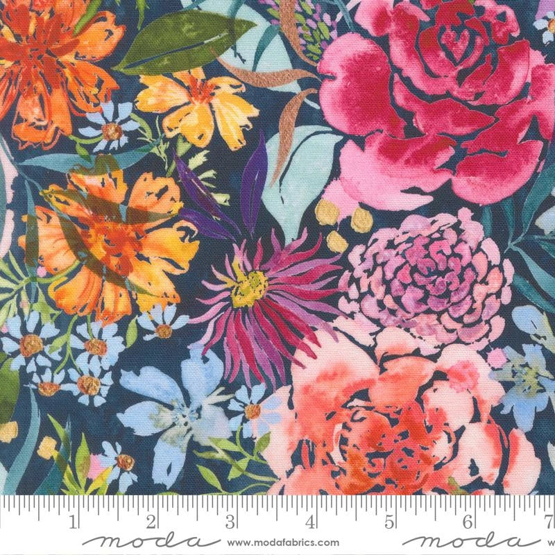 Soulstice Midsummer Bloom Navy Canvas Fabric Yardage by United Notions features large pink, orange, yellow, and purple flowers with green leaves on a dark navy background. A Moda-branded ruler appears along the bottom edge.