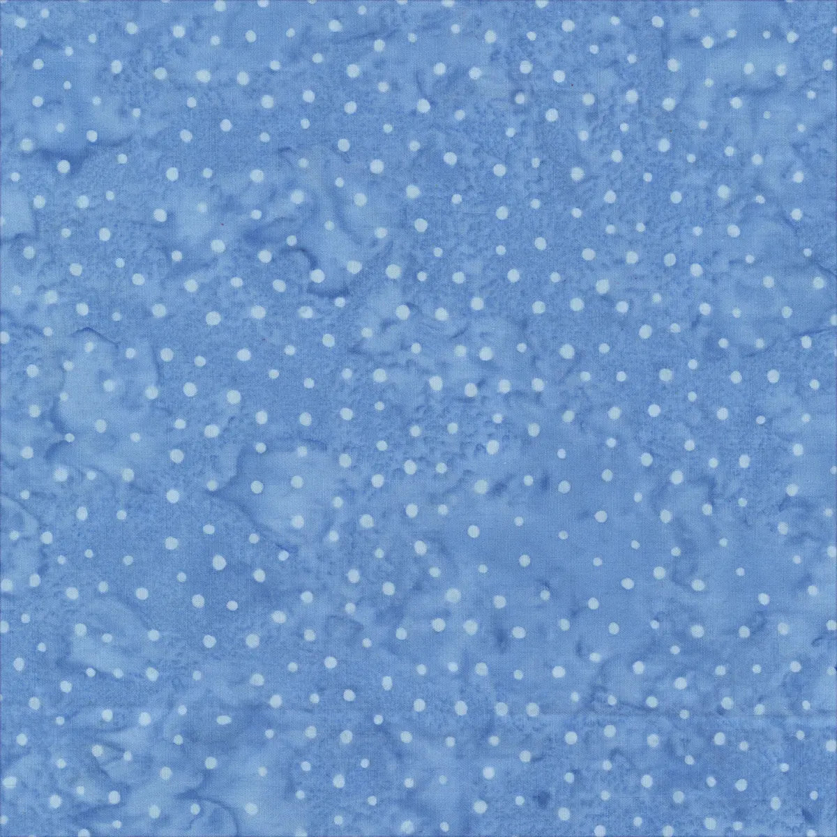 Quiltessentials Charm Sky Mini Dots Fabric Yardage by Windham Fabrics features a blue, batik-inspired background with small, evenly spaced white polka dots and a gently wrinkled, cloud-like texture.