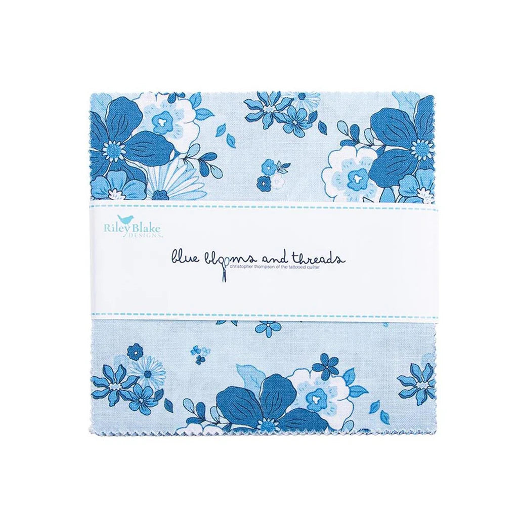 The Blue Blooms and Threads 5" Stacker by Riley Blake includes blue and white floral 5-inch fabric squares, neatly wrapped with a white label.