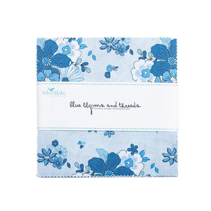 The Blue Blooms and Threads 5" Stacker by Riley Blake includes blue and white floral 5-inch fabric squares, neatly wrapped with a white label.