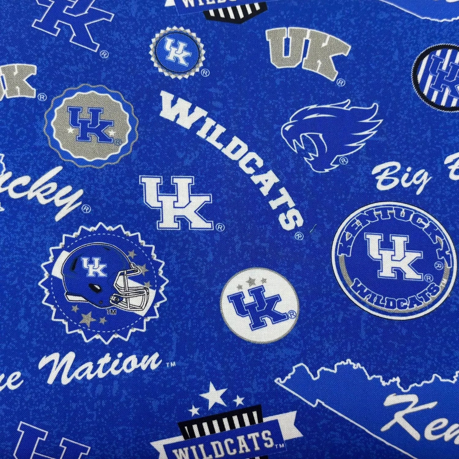 University of Kentucky Home State Fabric Yardage features blue NCAA fabric with UK logos, wildcat head, football helmet, Wildcats, Big Blue Nation, and Kentucky state outline in white, blue, and gray—perfect for Wildcats fans!.