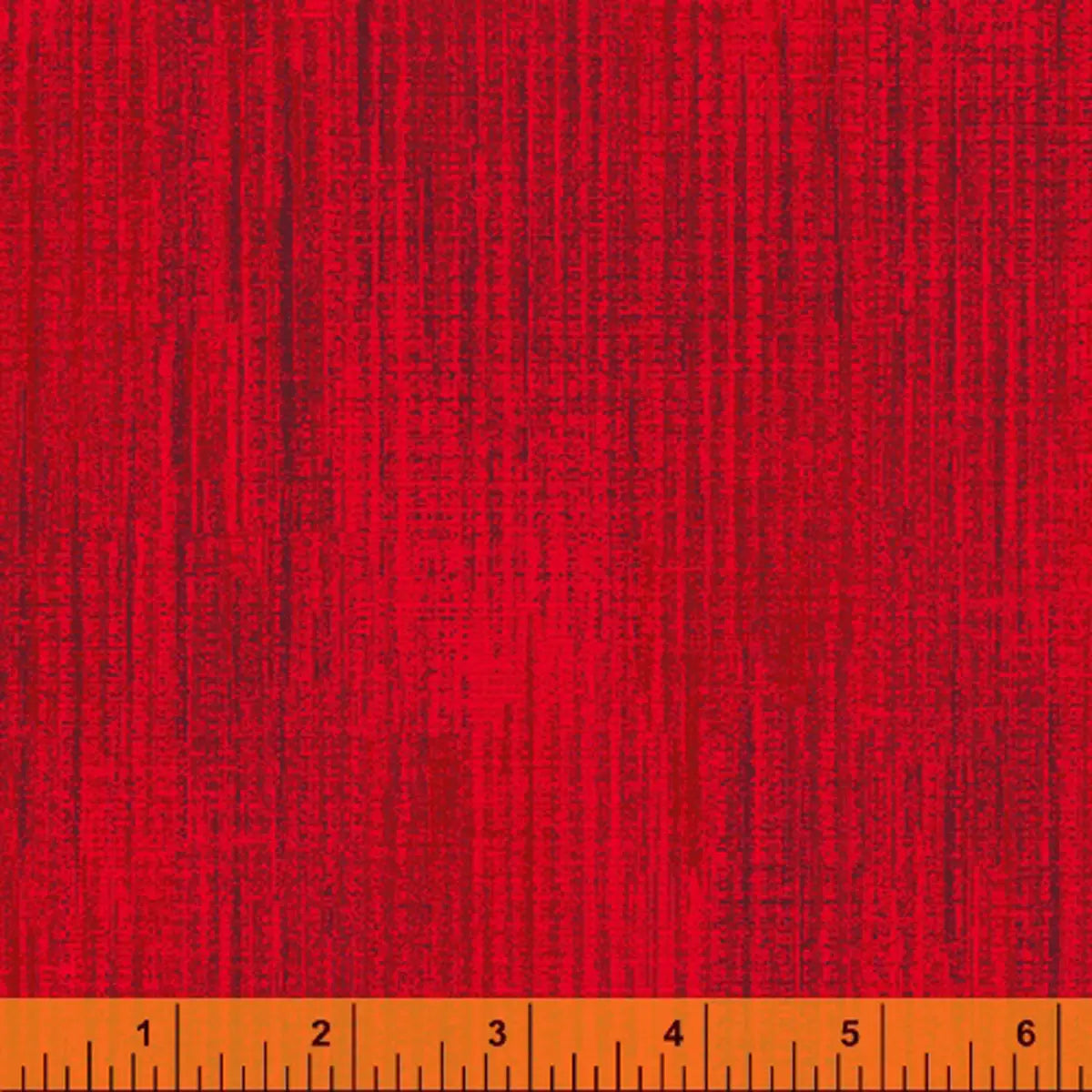 Terrain Pomegranate Fabric Yardage by Windham Fabrics showcases a red textured surface with subtle woven lines. An orange ruler at the bottom edge marks measurements from 1 to 6 inches.