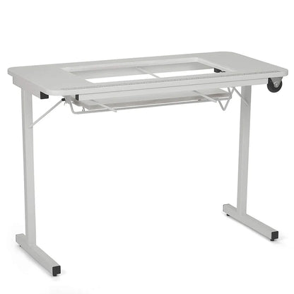 The Arrow Gidget II Sewing Table by Arrow Companies, LLC features a sleek white design, rectangular glass insert top, metal frame, pull-out keyboard tray, and wheeled leg for easy movement—ideal for creative workspaces.