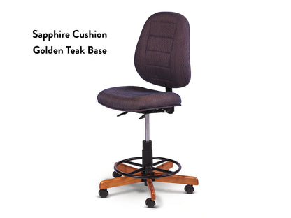 The Koala SewComfort Chair features a sapphire blue cushion, adjustable height, footrest ring, and a five-wheel golden teak base—ideal as an ergonomic sewing chair. Text on left: “Sapphire Cushion Golden Teak Base.”.