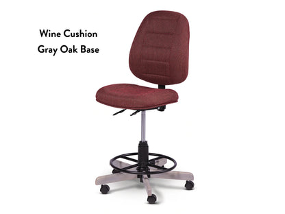 The Koala SewComfort Chair is a tall ergonomic sewing chair with a wine cushion, gray oak base, foot ring, adjustable height levers, and five wheels for mobility. Text on the left reads: Wine Cushion Gray Oak Base.