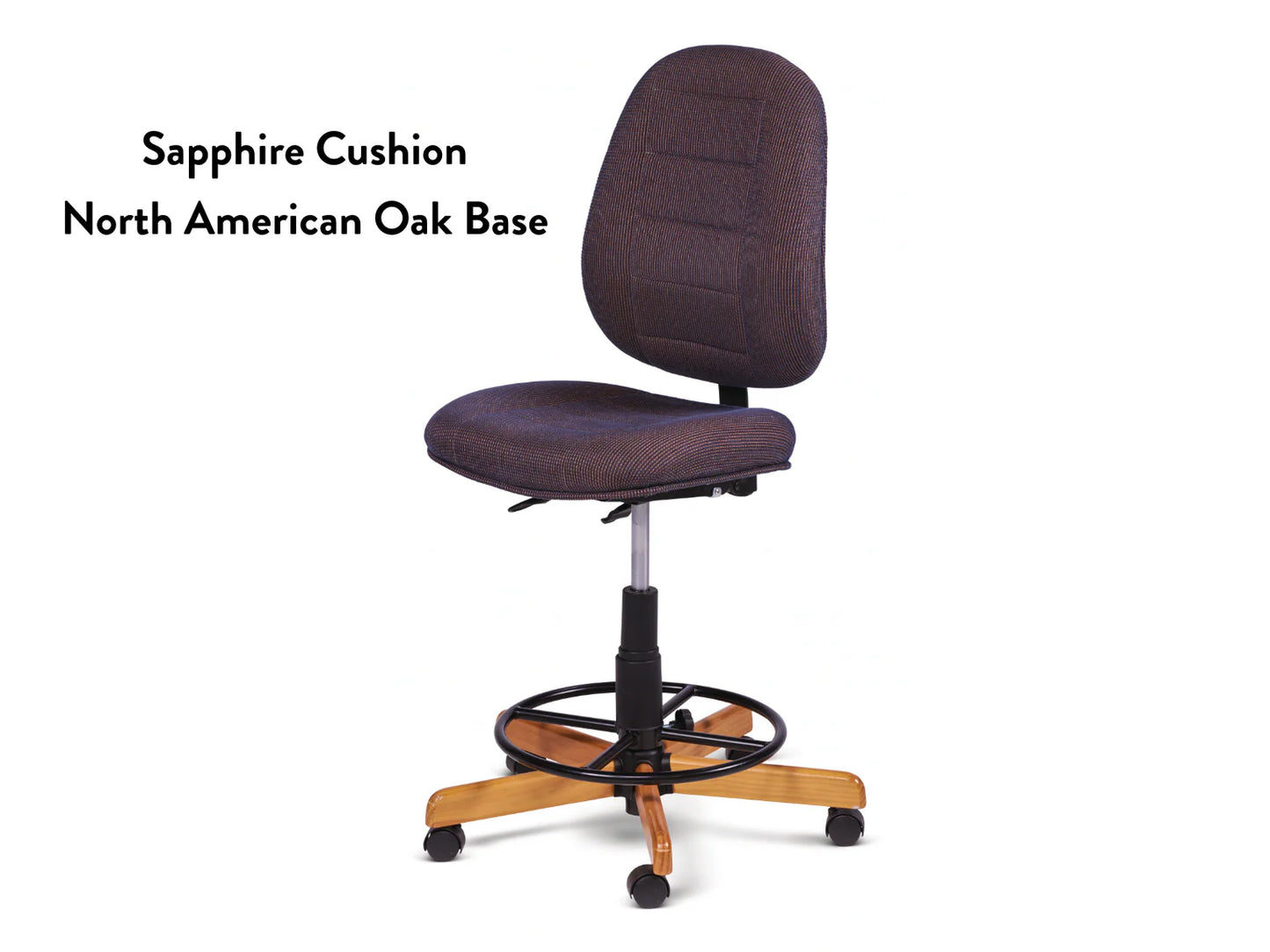 The Koala SewComfort Chair features a dark blue Sapphire cushion, high backrest, textured seat, circular footrest, and a five-wheel North American oak base for ergonomic comfort and style. Text: Sapphire Cushion North American Oak Base.