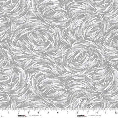 QT Fabrics' Tempest Silver Swirl 108" Wide 3 Yard Quilt Fabric Back Pack features a gray and white feather-like swirled pattern, seamless texture, and ruler markings in inches from 0 to 12 along the bottom edge—ideal for quilt backing.