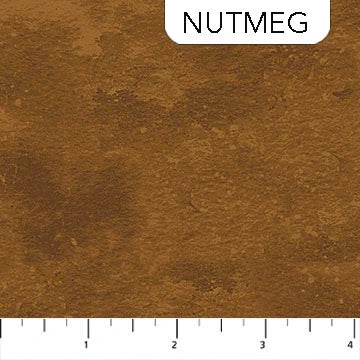 A sample swatch of Toscana Nutmeg Fabric Yardage by Northcott is labeled "NUTMEG" at the top right, with a ruler showing 1–4 inches below. The quilting cotton surface has a textured, earthy appearance.