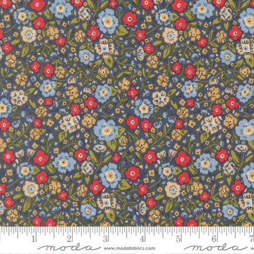 The Henhouse Calico Small Floral Denim Fabric by United Notions features tiny red, blue, yellow, and white flowers with green leaves on a dark background. A ruler in the image shows the scale in inches.