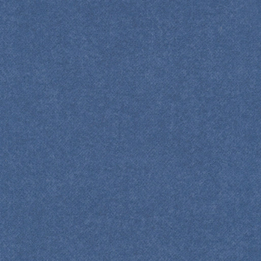 Benartex Winter Wool Blue Flannel Fabric Yardage features a soft, textured blue surface with a cozy, mottled look—perfect for adding the warmth of cotton flannel to your next project.