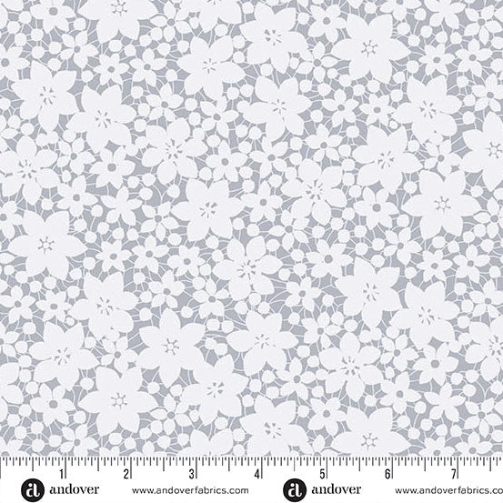 The Andover Color Me Whispered Silver Laced Blooms Fabric Yardage features seamless quilting cotton with white flowers and leaves on light gray, floral clusters, and a bottom-edge ruler marked in inches.