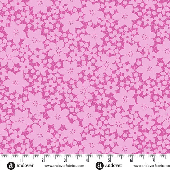 The Color Me Whispered Pink Laced Blooms Fabric Yardage by Andover features seamless pink floral patterns on a light pink background, with an inch ruler along the bottom and branded edge details.