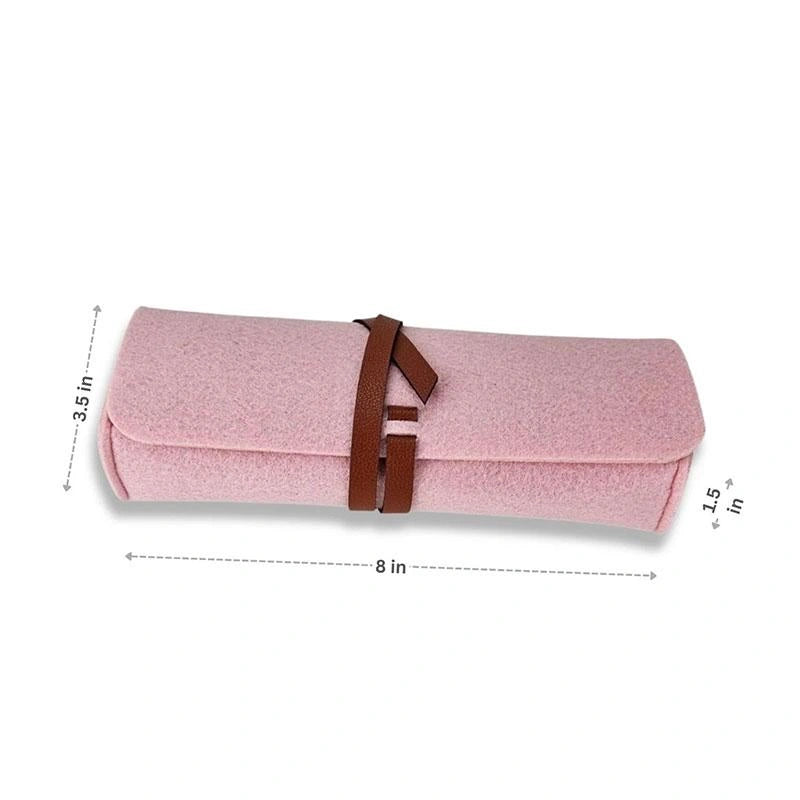 The Felt Pencil Notion Pouch D Rose is a pink Meori roll-up pouch with a brown vegan leather closure, measuring 8" x 3.5" x 1.5".