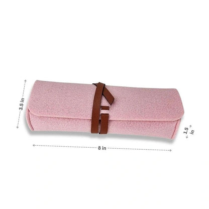 The Felt Pencil Notion Pouch D Rose is a pink Meori roll-up pouch with a brown vegan leather closure, measuring 8" x 3.5" x 1.5".