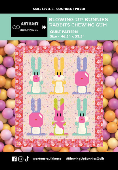 A vibrant quilt featuring six pixel-style bunnies, some chewing gum, on a pink border with pastel balls. Showcases Checker Distributor’s “Blowin Up Bunnies - Rabbits Chewing Gum Quilt Pattern” and includes social media handles.