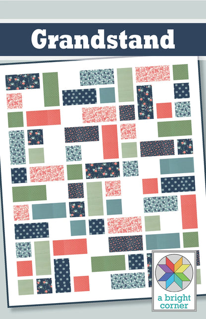 The Grandstand Quilt Pattern by Checker Distributor features rectangular pieces in coral, navy, green, and floral prints with multiple size options. A colorful geometric logo appears at the bottom right.