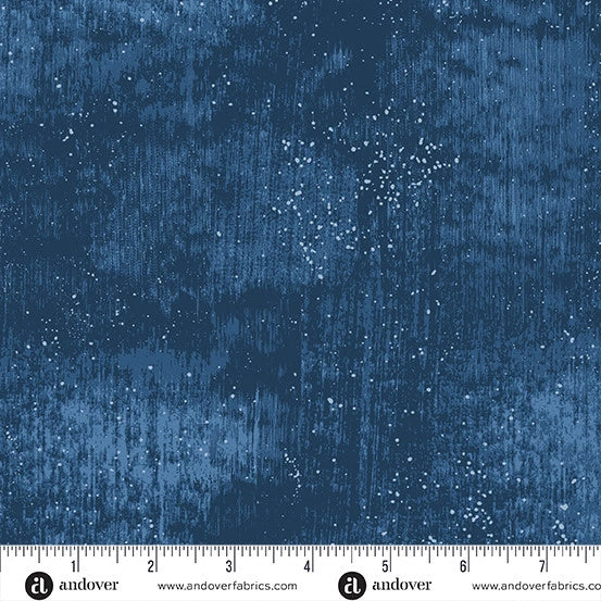 Glaze Prussian 108" Wide Quilt Backing Fabric by Andover features a textured Prussian blue design with dark/light blue shades, white speckles, and a white inch ruler at the bottom—ideal for bold quilting projects.