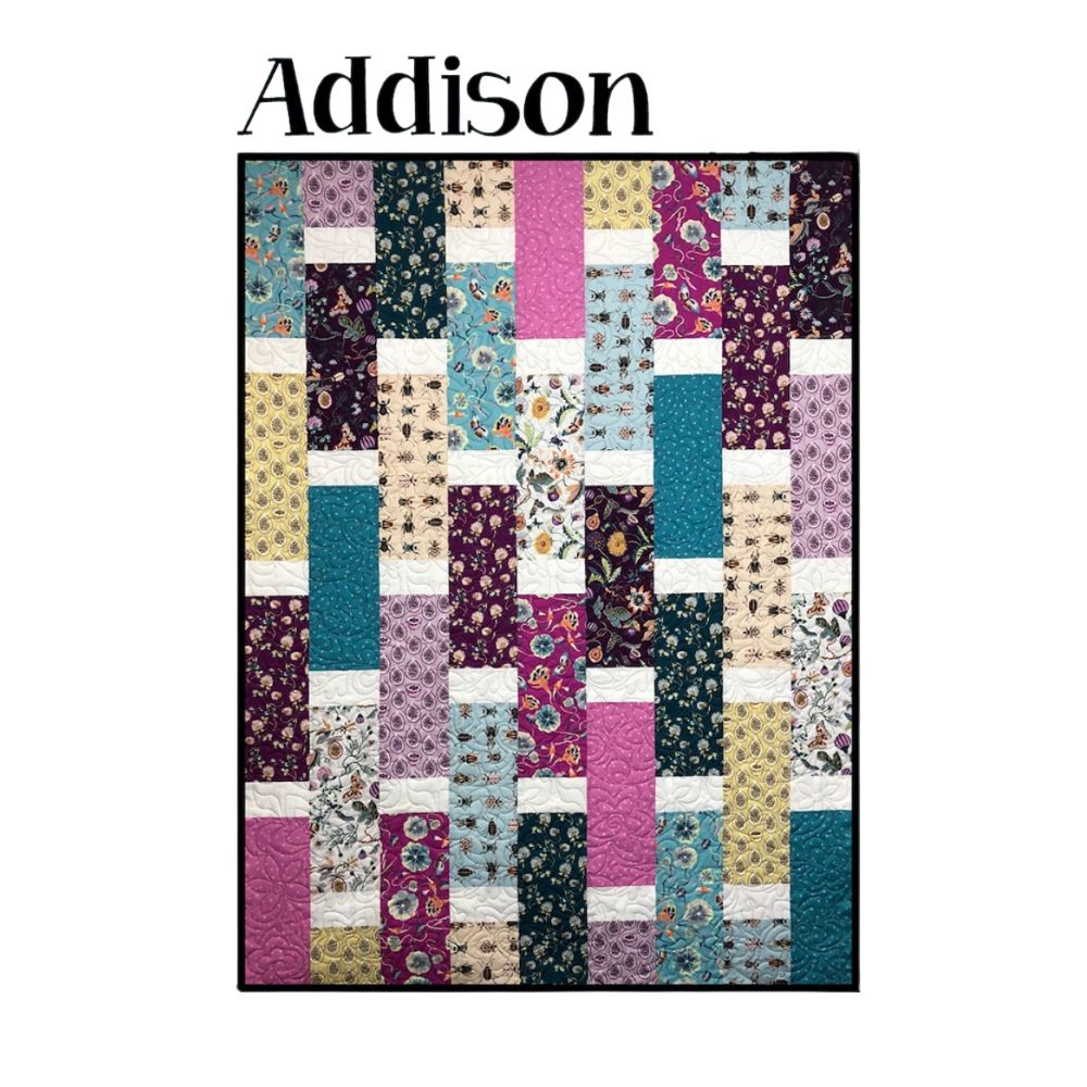The Addison Quilt Class features a colorful Villa Rosa Designs quilt with vertical and horizontal strips in teal, purple, pink, yellow, cream, and floral prints—ideal for your next quilting project!.