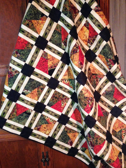 Go Crazy quilt pattern finished quilt with dark green red cream scrap block design