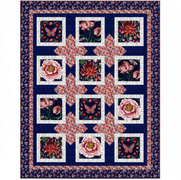 The Cameo Appearance Quilt Kit by Quilted Joy features a dark blue background with squares of pink and red florals and butterflies, inspired by bold floral quilt styles. The border showcases a repeating butterfly design.