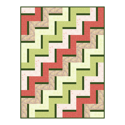 The Quilted Joy Clover Path Quilt Kit features a nature-inspired zigzag pattern in green, red, pale yellow, pink, and cream with solid and floral prints in interlocking rectangles—perfect for adding charm to your space.