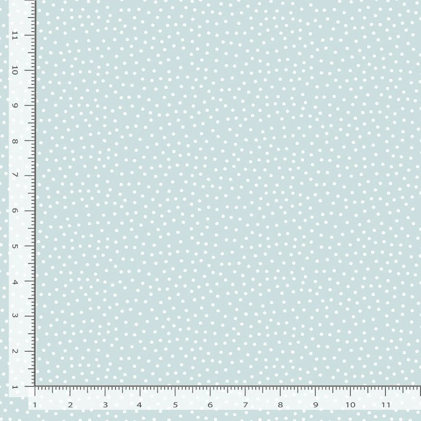 'Til the Cows Come Home Chambray Dots Fabric Yardage by Timeless Treasures features light blue cotton with small white polka dots, shown beside a ruler in inches and centimeters. Perfect for quilting, sewing projects, and crafts.
