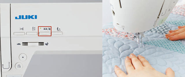 The drop feed button on the JUKI Hayate DX-4500QVP button panel beside a pair of hands free-motion quilting pale blue fabric.