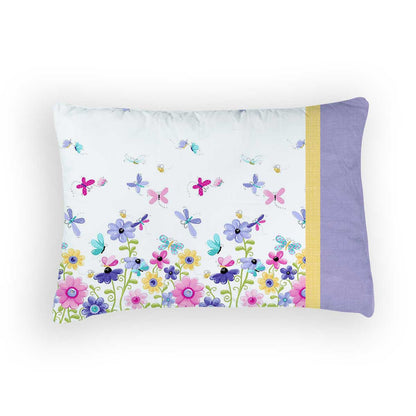 The Flutter Butterfly Pillowcase Kit by Quilted Joy is a 100% cotton case with floral and dragonfly prints in pink, blue, and purple, finished with a solid lavender and yellow border on one side.