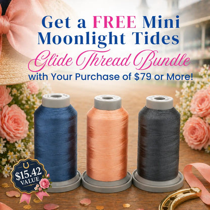 Three spools from the Moonlight Tides Glide Thread of the Month Bundle by Hab+Dash by Fil Tec—navy blue, peach, and charcoal—are shown with pink roses and a hat. Get a free mini thread bundle ($15.42 value) with your $79 purchase.