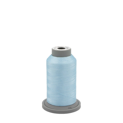 A large spool of Hab+Dash Glide Thread Cloud 37457 polyester thread sits upright on a gray plastic base, ideal for machine quilting, against a plain white background.