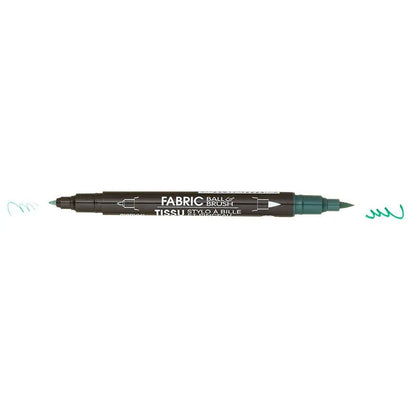 The United Notions Marvy Fabric Ball & Brush Marker is a double-ended black marker with white labeling, featuring a fine tip on the left and a brush tip on the right that both create teal squiggles.