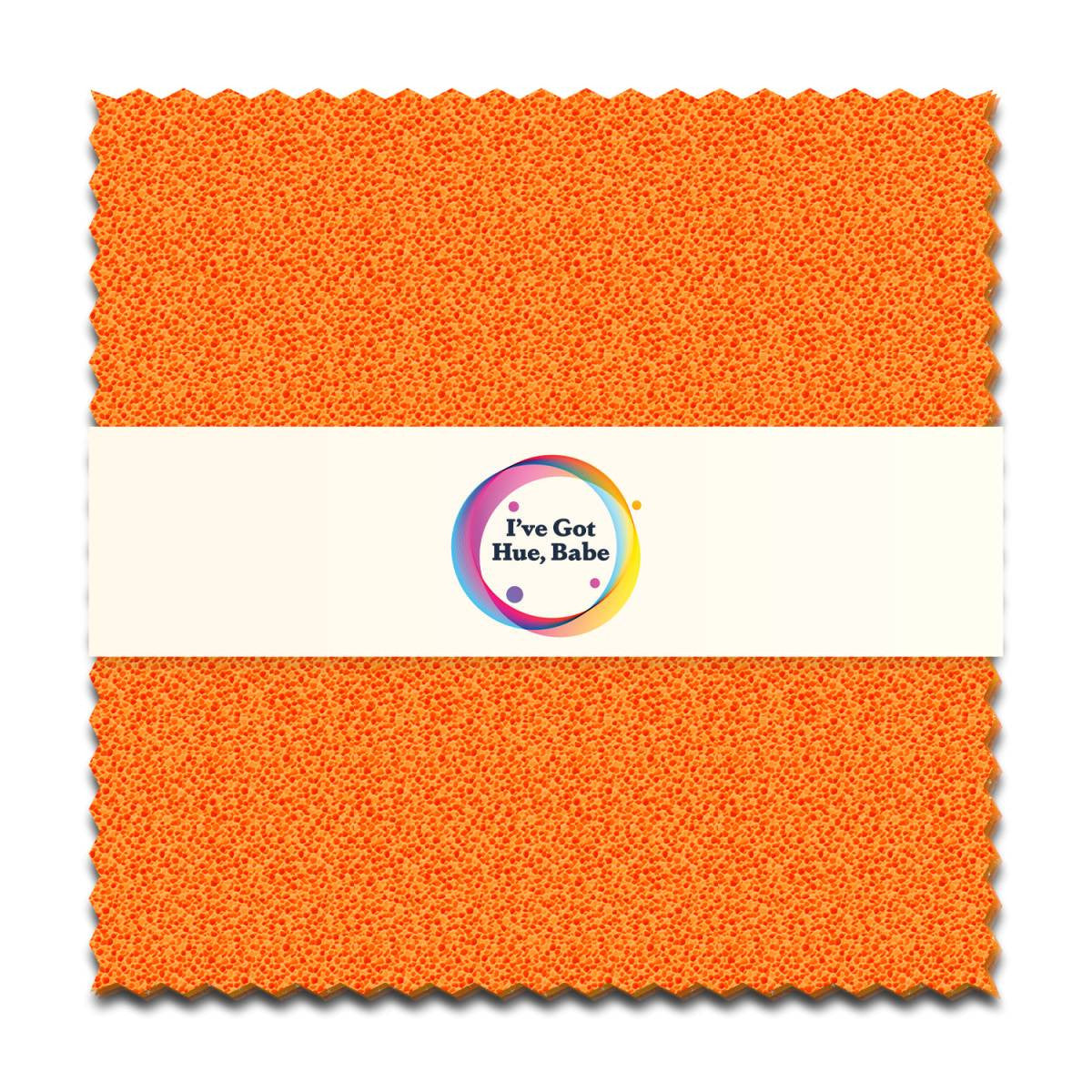 A square orange textured precut quilt fabric swatch with zigzag edges. A white band at the center displays a colorful circular logo and the text I've Got Hue, Babe Marmalade 5" Squares by Jaftex - Henry Glass Fabrics.