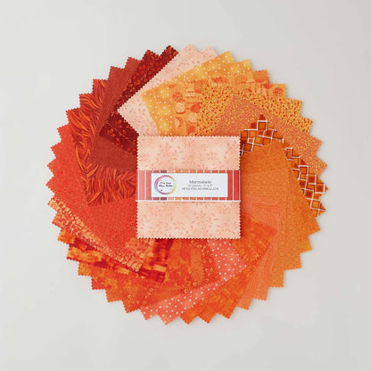 A circular array of orange and yellow patterned precut quilt swatches fans out around a square charm pack labeled "I've Got Hue, Babe Marmalade 5" Squares" by Jaftex - Henry Glass Fabrics, displayed on a white background.