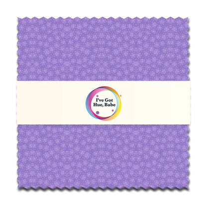 A 5" square of light purple fabric from I've Got Hue, Babe Purple Rain by Jaftex - Henry Glass Fabrics shows a subtle star print, wrapped in a cream band with a colorful circular logo and the text "I've Got Hue, Babe.