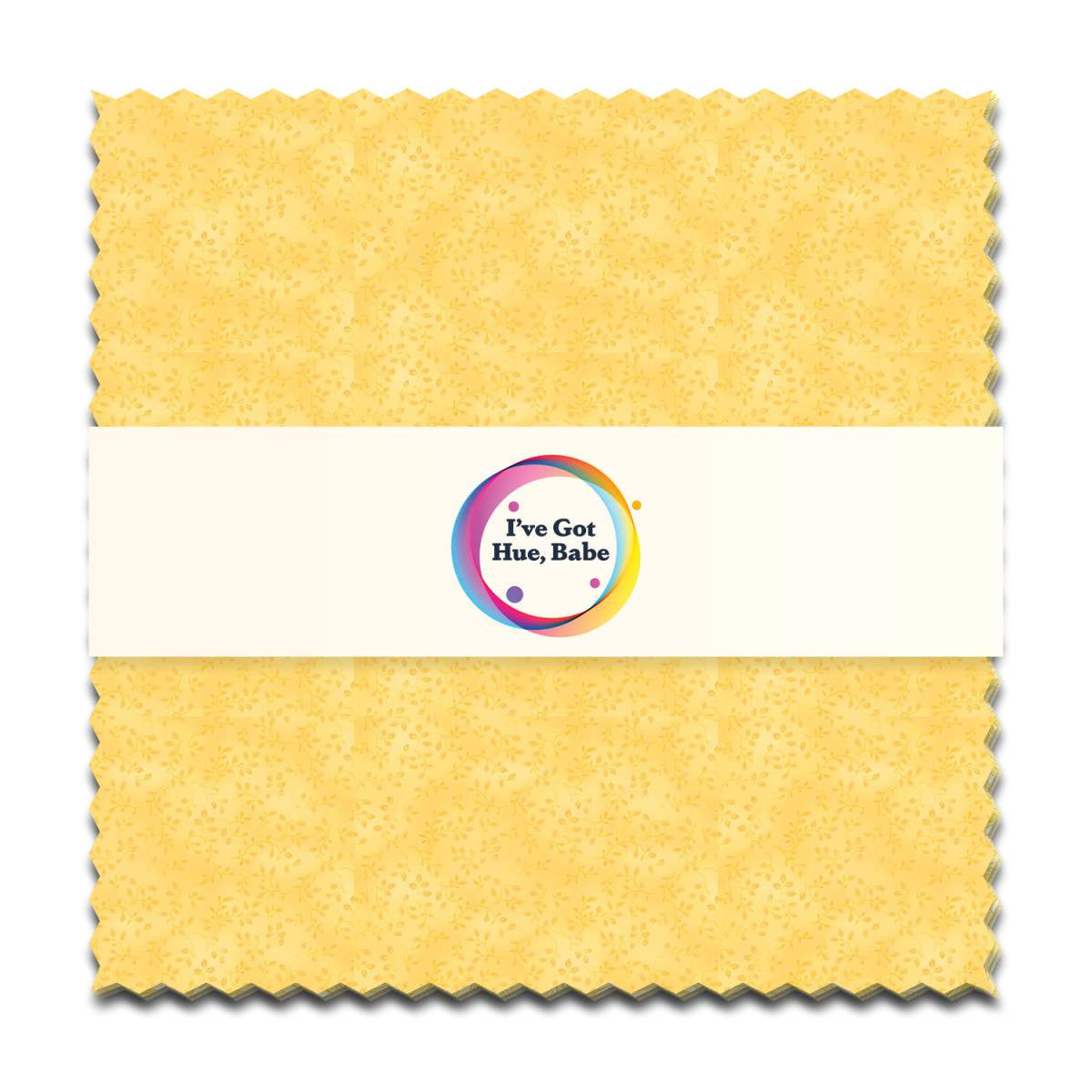 A 5" square yellow textured fabric swatch with zigzag edges from Jaftex - Henry Glass Fabrics, wrapped in a white band featuring a colorful logo that says "I've Got Hue, Babe Sunny Side Up.