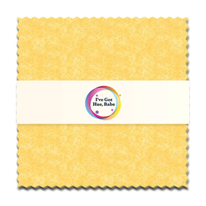 A 5" square yellow textured fabric swatch with zigzag edges from Jaftex - Henry Glass Fabrics, wrapped in a white band featuring a colorful logo that says "I've Got Hue, Babe Sunny Side Up.
