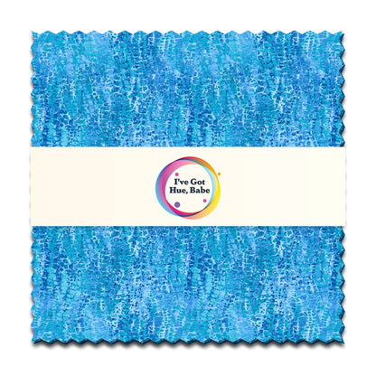 The Jaftex - Henry Glass Fabrics "I've Got Hue, Babe Turquoise Waves" charm pack features 5" precut turquoise fabric squares with zigzag-cut edges, a white center band, and a colorful circular logo.