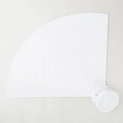 A roll of white disposable napkins is partially unrolled on a light-colored surface, resembling the fan-like pattern of Jaftex - Henry Glass Fabrics I’ve Got Hue, Babe White Knight 2.5in Strips quilt precuts.