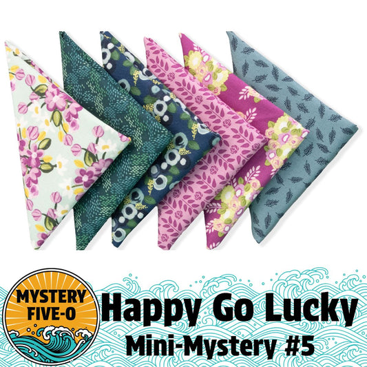 Six triangular fabric pieces with green, pink, and purple floral and leaf patterns are arranged in a row. Text reads: Quilted Joy Mystery Five-0 Morning Meadow "Happy Go Lucky" Fat Quarter Bundle—perfect for a charming mini mystery quilt!.