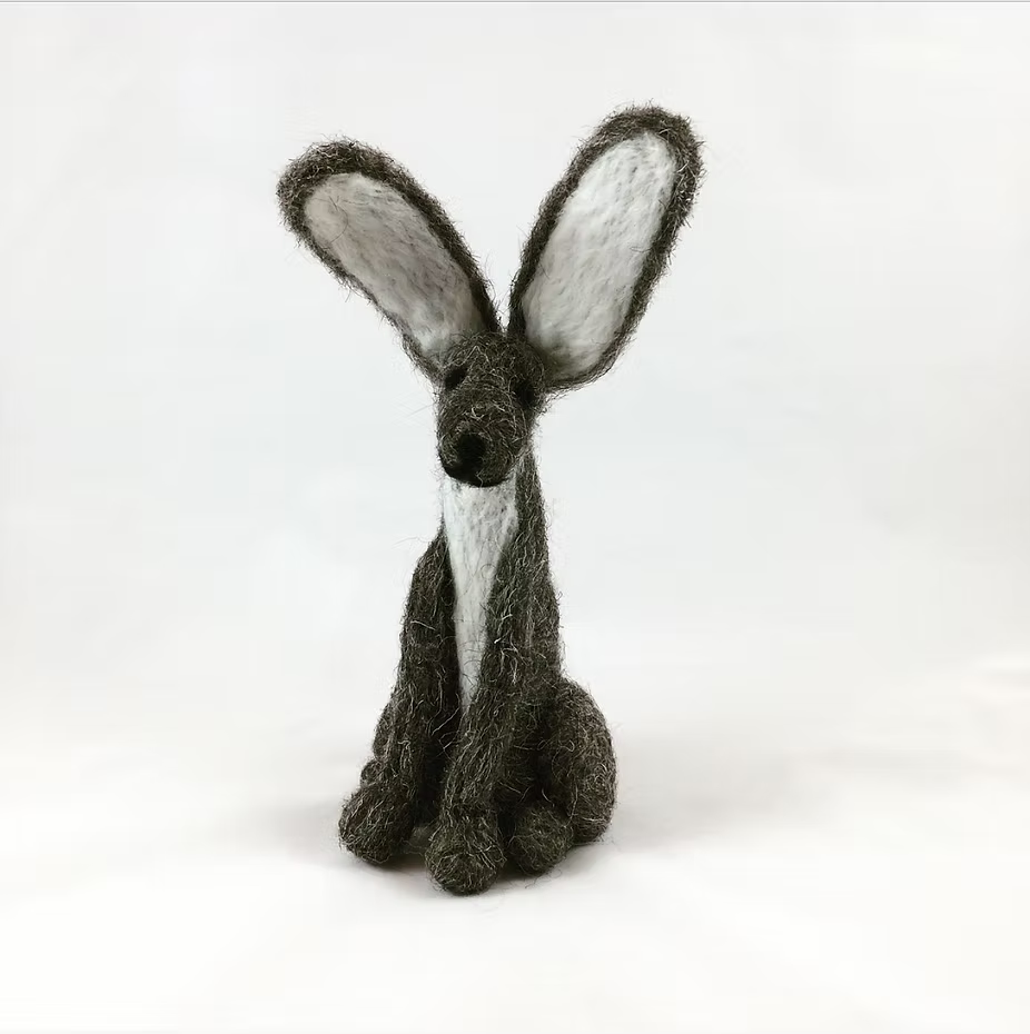 The Grey Hare - Needle Felting Kit No Foam by Feather Felts lets you craft a charming upright grey rabbit with a white chest and ears, perfect for beginners looking to explore wool sculpture art.
