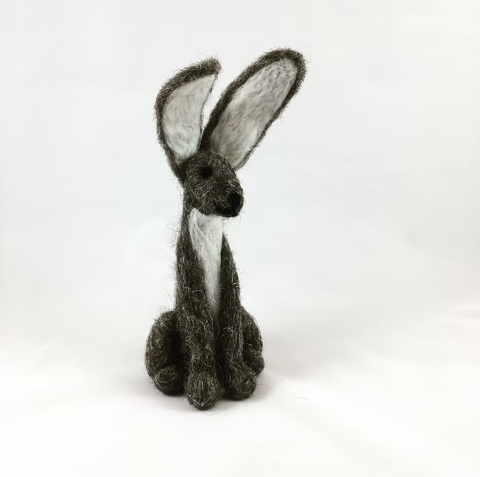 The Grey Hare - Needle Felting Kit No Foam by Feather Felts lets you create a handmade felt hare with large ears, gray fur, and a white chest—a charming project for beginner needle felters.