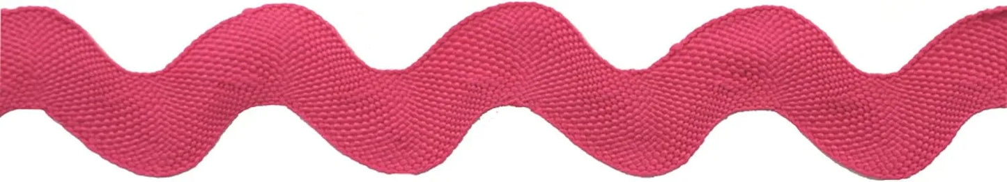 A close-up of Rick Rack 1-1/4" Wide, a pink wavy polyester trim with a zigzag pattern, ideal for sewing or embellishments, set against a white background.