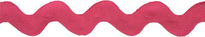 A close-up of Rick Rack 1-1/4" Wide, a pink wavy polyester trim with a zigzag pattern, ideal for sewing or embellishments, set against a white background.