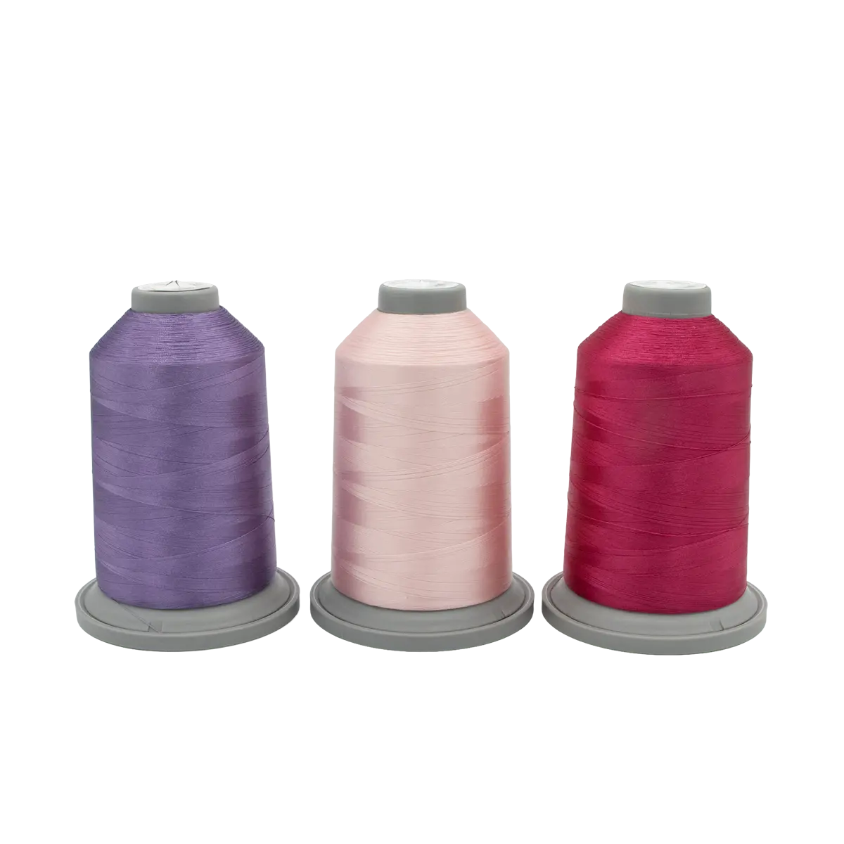 Three spools of Hab+Dash by Fil Tec thread in purple, light pink, and dark pink are arranged side by side—perfect for your next Hyacinth Haven Glide Thread of the Month Bundle.