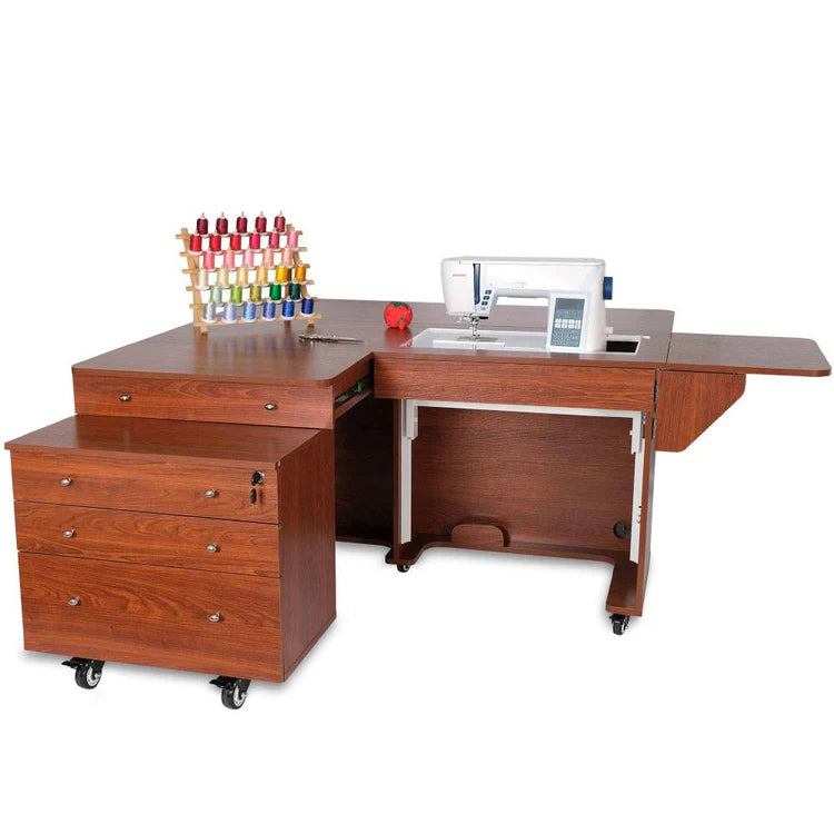 The Kangaroo & Joey Cabinet Set (available in 3 colors) with an integrated sewing machine, thread rack, red pincushion, and wheeled three-drawer unit creates the ideal sewing furniture setup.