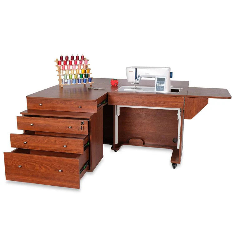 The Kangaroo & Joey Cabinet Set (available in 3 colors) features an extended work surface, storage below, three open drawers, a spool rack with colorful thread, a tomato pincushion, and a sewing machine on top.
